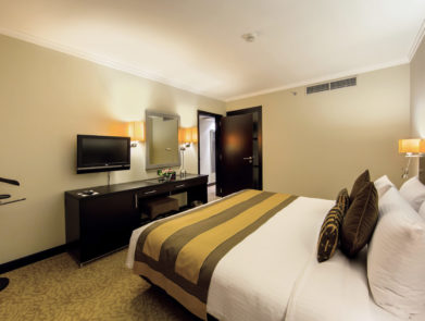 Deluxe-Suite-Bedroom-1-e1572805266130-391x295